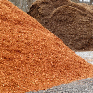 Mulch piles at commercial mulch production facility.