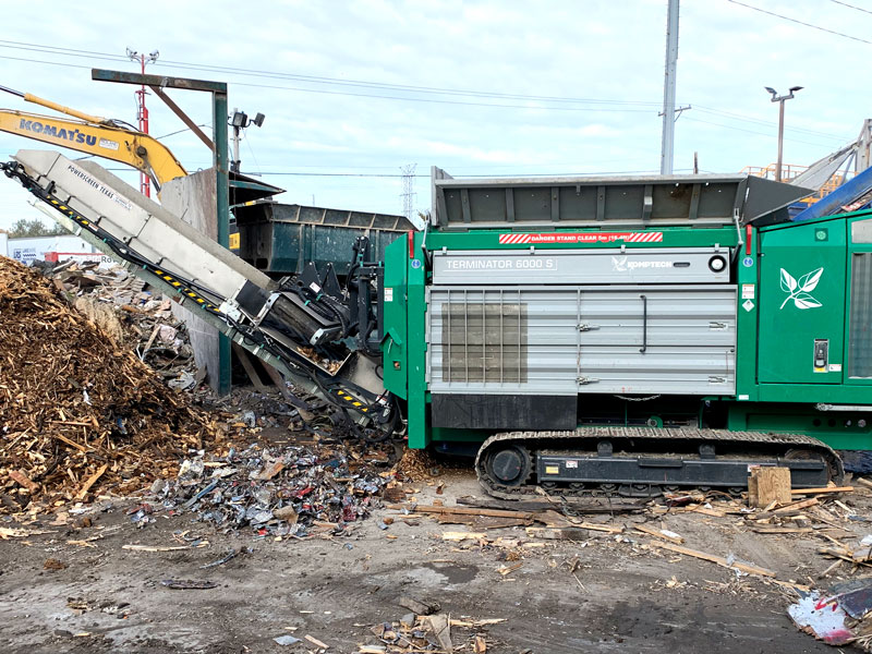 The Komptech Terminator shredder separating metals from the discharge material with overband magnet.