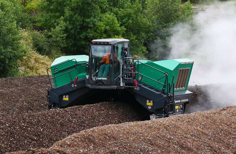 Topturn X windrow turner processing compost windrows.