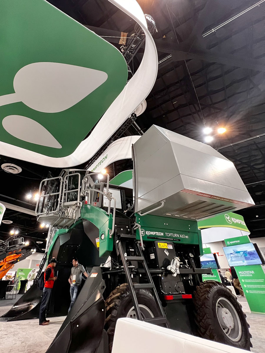 The Komptech Americas booth at COMPOST 2023 featuring the Topturn X63 on display.